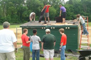 Troop 17 Scouts Re-roof dugout at Overocker Park.
